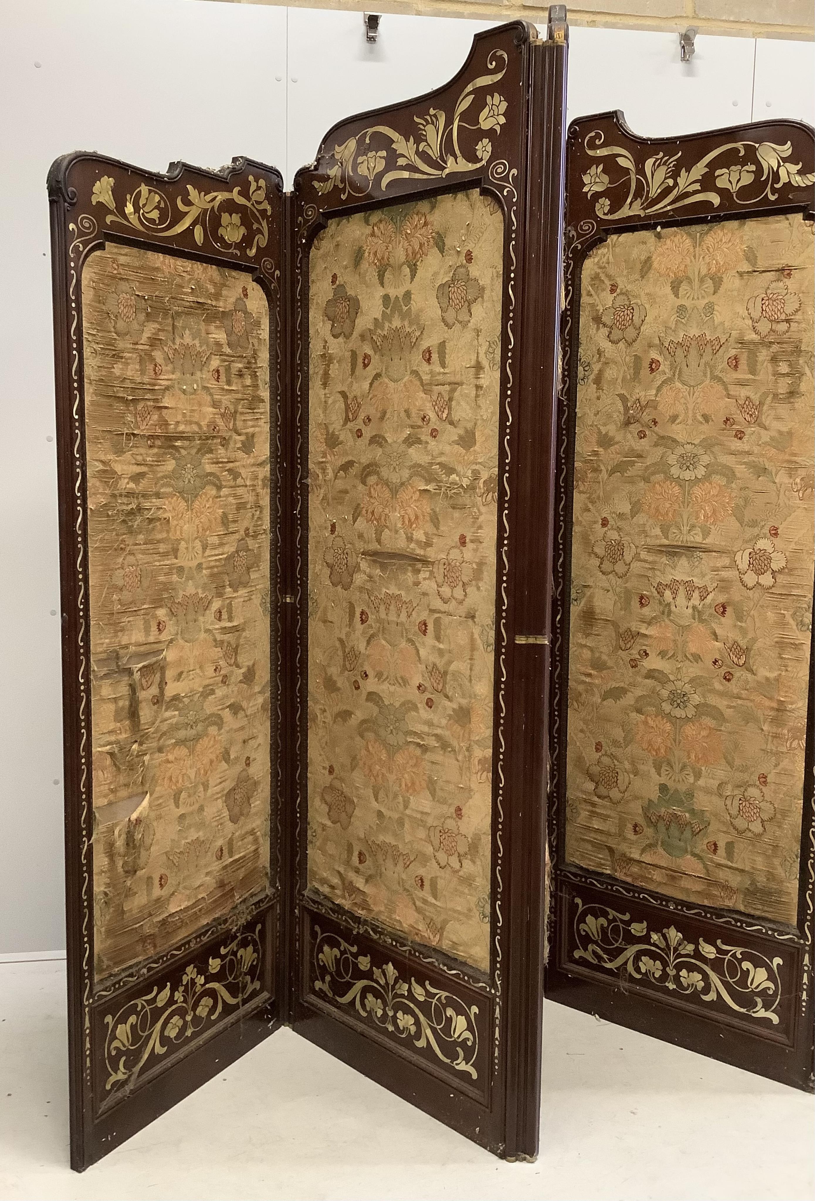 An Art Nouveau mother of pearl inlaid five fold screen, inset silk thread embroidered panels, largest panel width 64cm, height 213cm. Condition - fair to good, one panel poor